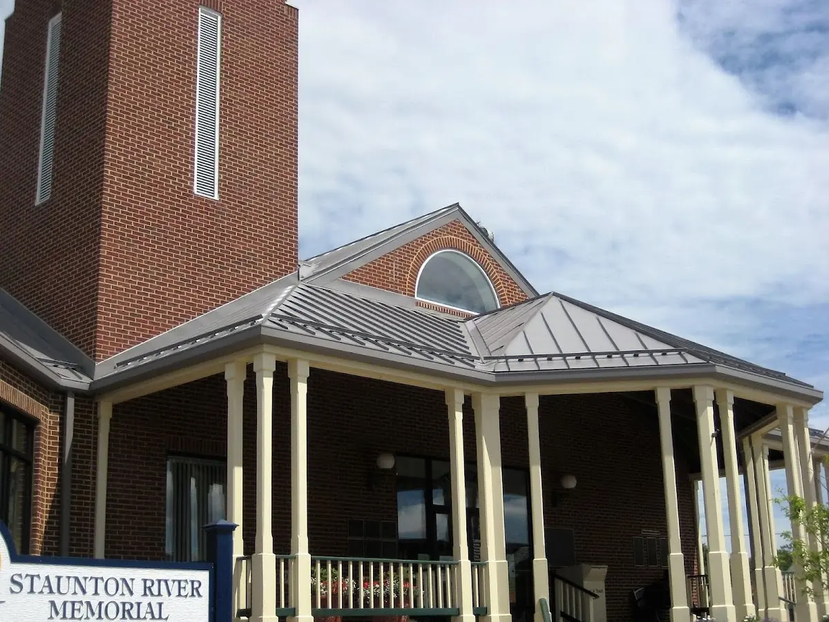 Skilled roofing craftsmen working on a residential roof in Poughkeepsie